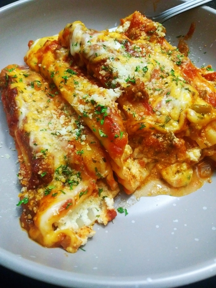 baked manicotti with sauce and cheese
