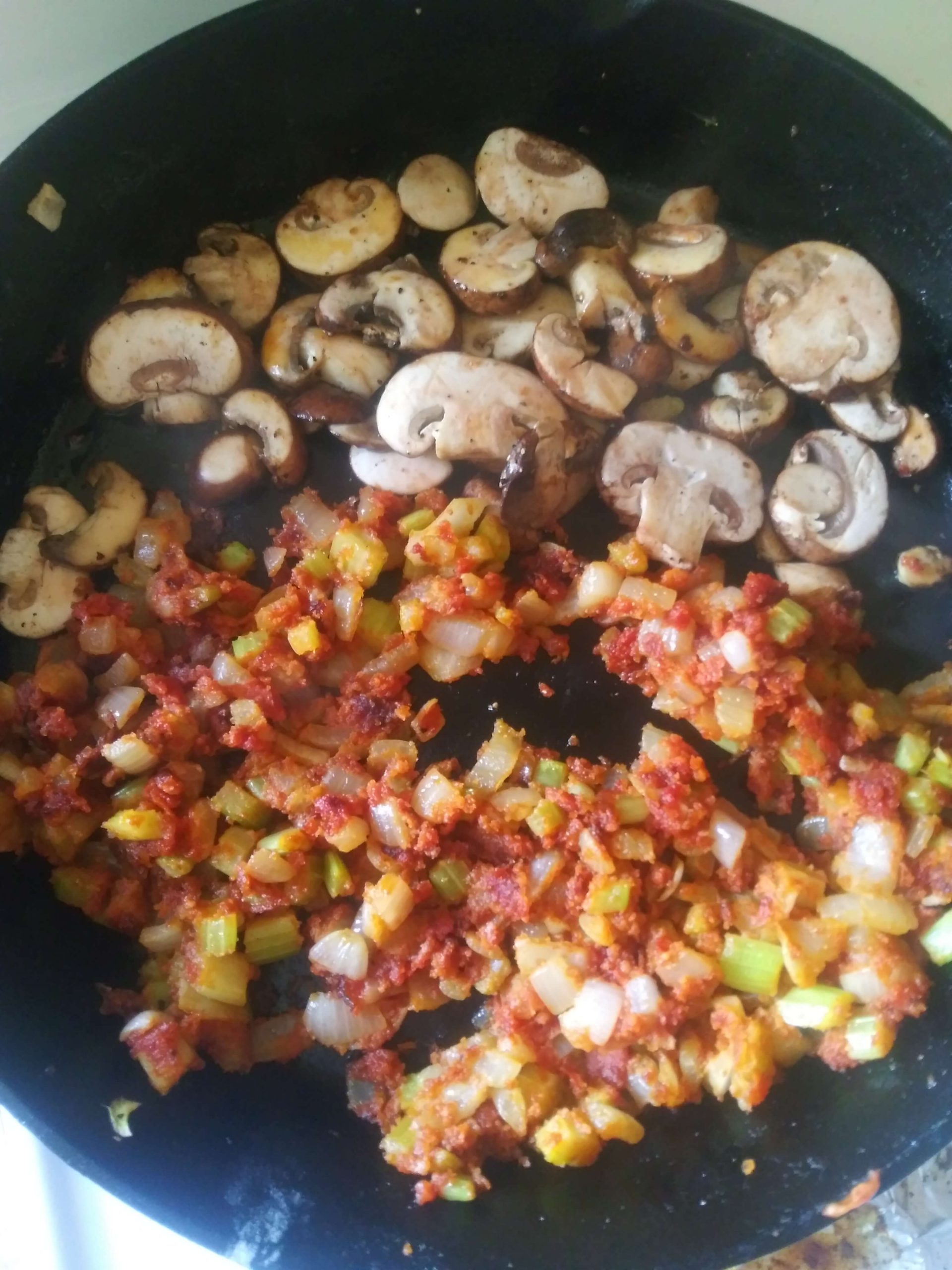 mushrooms and veggies in cast iron skillet