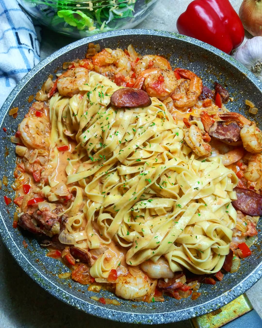 pan of cajun shrimp and sausage pasta with pasta in pan