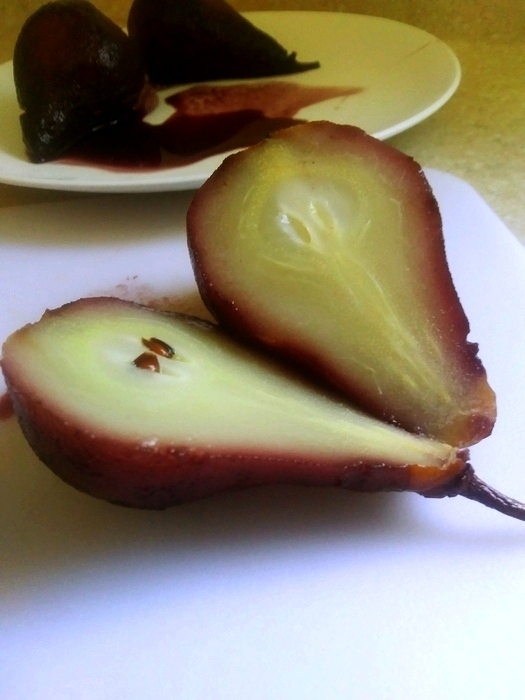 red wine poached pear sliced in half