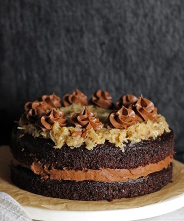 German chocolate cake with chocolate frosting in the center.