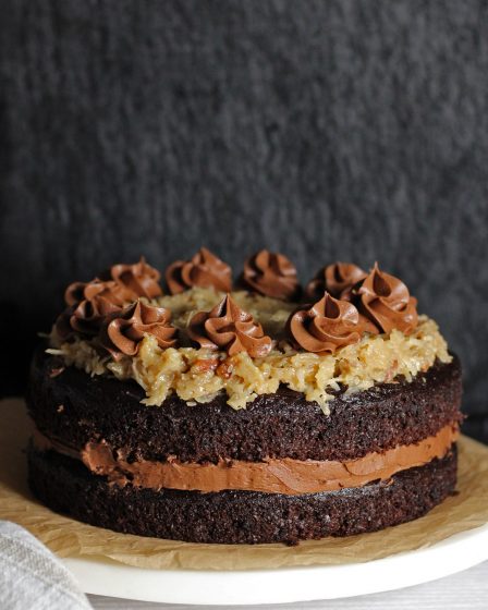 German chocolate cake with chocolate frosting in the center.