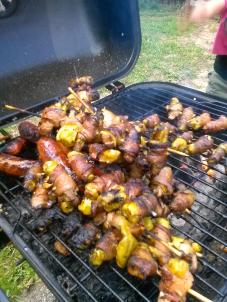 bacon-wrapped greek peppers on grill