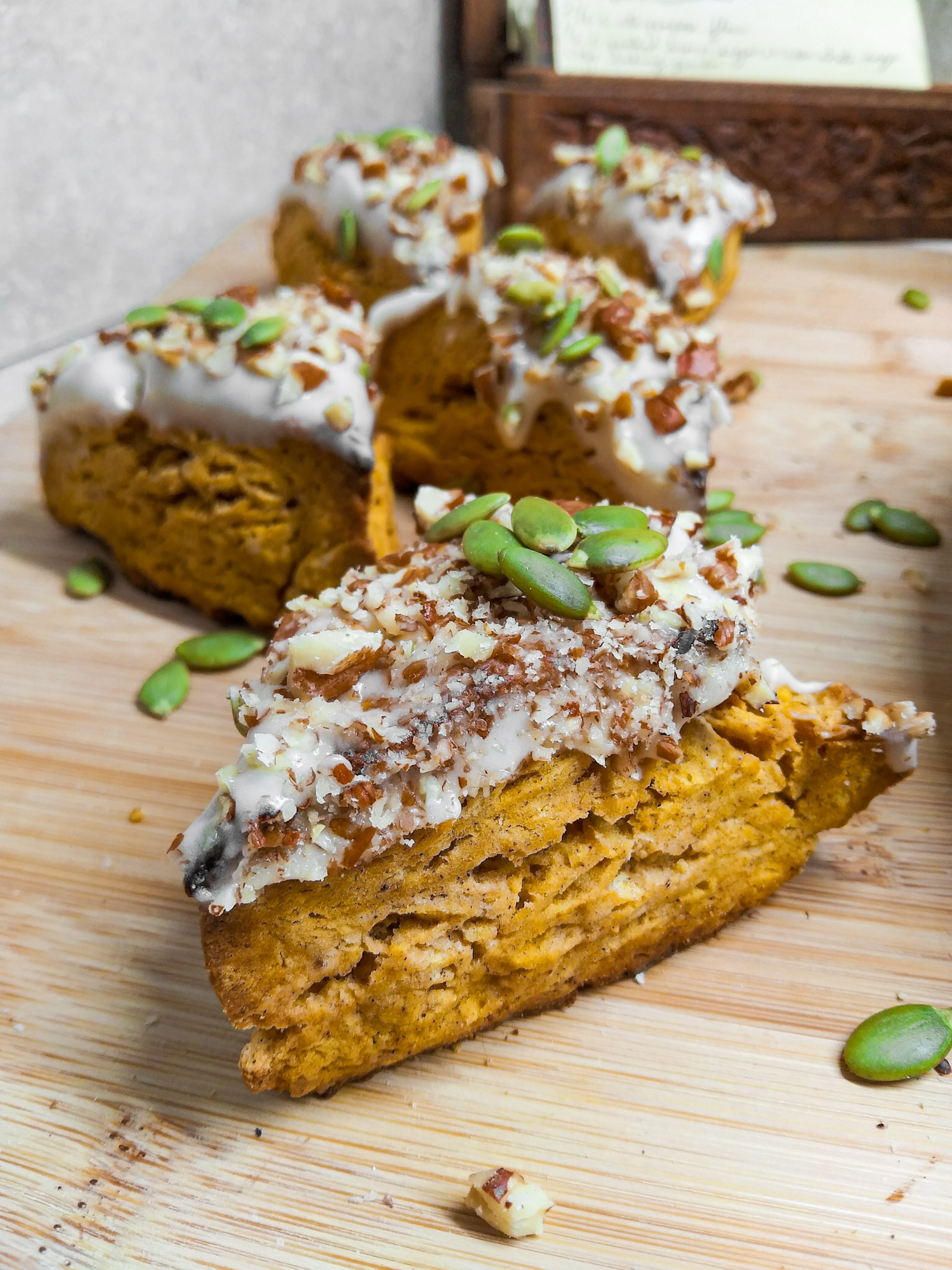 Pumpkin Scones with Maple Icing, Pepitas and Nuts - Ladle and Grain