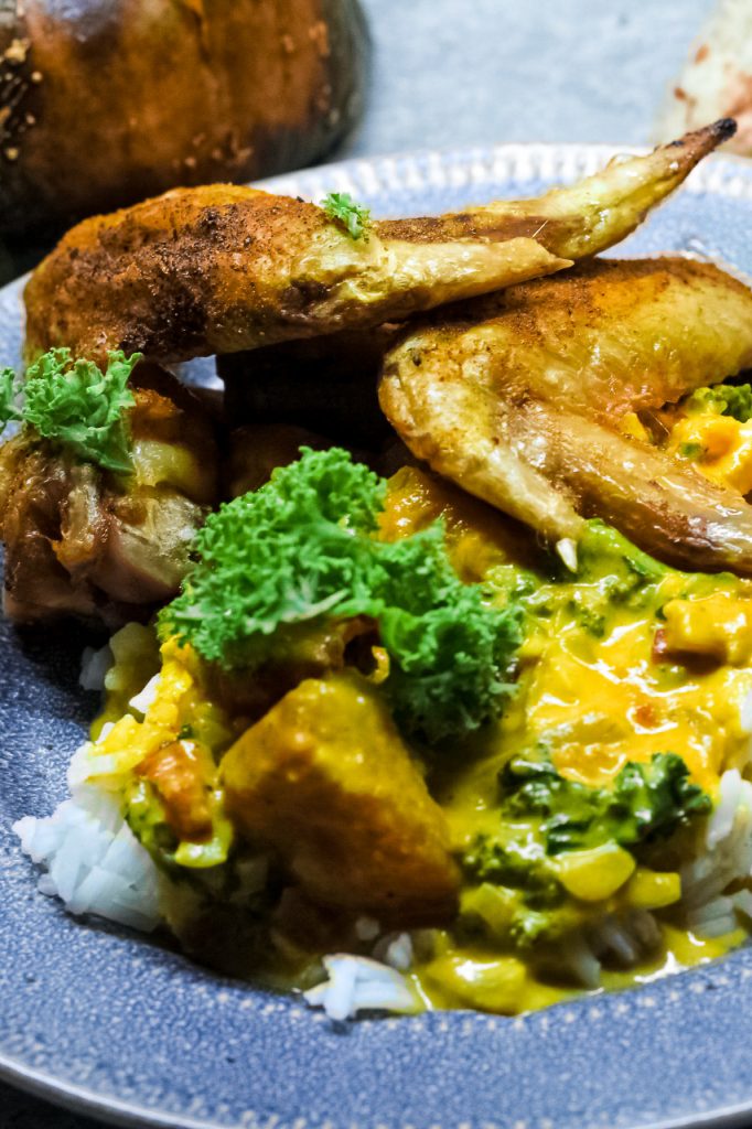 curried baked chicken wings served over buttercup squash curry