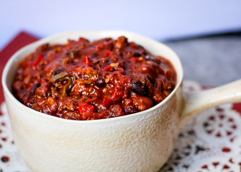 hot italian sausage spicy slow cooker chili in a bowl.