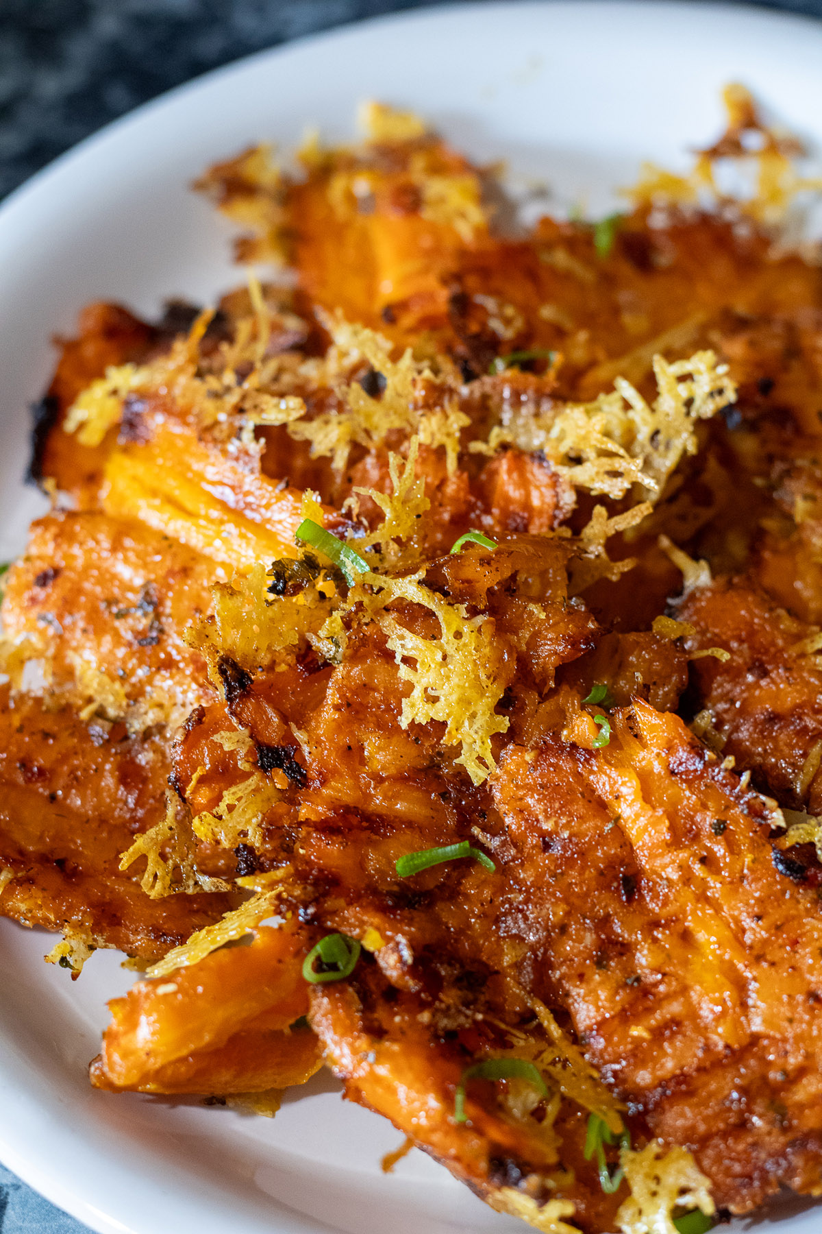 Roasted smashed carrots with parmesan cheese.